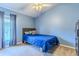 Light blue bedroom with a double bed and built in shelves at 13793 Dunwoody Dr, Spring Hill, FL 34609