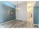 Open dining room showcasing hardwood floors and neutral walls at 13793 Dunwoody Dr, Spring Hill, FL 34609