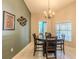 Dining room features a round table and chairs, and a view to a back yard at 13793 Dunwoody Dr, Spring Hill, FL 34609