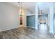 Bright dining room with hardwood floors and a chandelier at 13793 Dunwoody Dr, Spring Hill, FL 34609