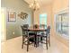 Bright dining area with a round table and four chairs, near a window at 13793 Dunwoody Dr, Spring Hill, FL 34609
