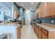 Modern kitchen with stainless steel appliances and wood cabinets at 13793 Dunwoody Dr, Spring Hill, FL 34609