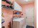 Laundry room with washer, dryer, and ample storage at 13793 Dunwoody Dr, Spring Hill, FL 34609