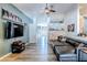 Open living room with hardwood floors and a sectional sofa at 13793 Dunwoody Dr, Spring Hill, FL 34609