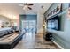 Relaxing living room with a sectional sofa and large TV at 13793 Dunwoody Dr, Spring Hill, FL 34609