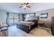 Spacious main bedroom with large bed and ceiling fan at 13793 Dunwoody Dr, Spring Hill, FL 34609