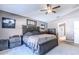 Main bedroom with king bed and ensuite bathroom access at 13793 Dunwoody Dr, Spring Hill, FL 34609