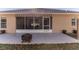 Relaxing screened patio with fire pit, perfect for outdoor enjoyment at 13793 Dunwoody Dr, Spring Hill, FL 34609