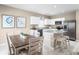 Modern kitchen with island, white cabinets, and granite countertops at 17104 6Th E Ter, Bradenton, FL 34212