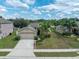 House with two-car garage and well-maintained lawn at 18732 Dobson Dr, Hudson, FL 34667
