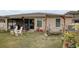 Landscaped backyard with a swing and patio furniture at 18732 Dobson Dr, Hudson, FL 34667