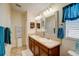 Bathroom with double vanity and a large walk-in shower at 18732 Dobson Dr, Hudson, FL 34667