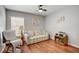 Bright home office features wood floors, comfortable seating, and built-in shelving at 18732 Dobson Dr, Hudson, FL 34667
