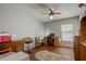 Home office with wood floors, built in desk and window light at 18732 Dobson Dr, Hudson, FL 34667