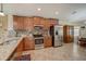 Kitchen features stainless steel appliances and wood cabinets at 18732 Dobson Dr, Hudson, FL 34667