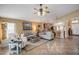 Living room with vaulted ceiling, neutral walls and tiled floor at 18732 Dobson Dr, Hudson, FL 34667