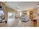 Open living room with tile floors and access to the patio at 18732 Dobson Dr, Hudson, FL 34667