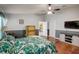 Main bedroom with hardwood floors and ensuite bathroom at 18732 Dobson Dr, Hudson, FL 34667