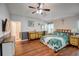 Large main bedroom with hardwood floors and ceiling fan at 18732 Dobson Dr, Hudson, FL 34667