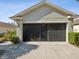 House exterior featuring a screened garage at 18803 Rolling Hills Loop, Hudson, FL 34667