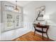 Bright entryway with hardwood floors, a console table, and natural light at 19617 Ellendale Dr, Land O Lakes, FL 34638