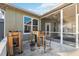 Backyard with screened porch, raised garden beds, and storage shed at 3110 Lema Dr, Spring Hill, FL 34609