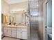 Bathroom boasts double sinks, shower with grab bars, and updated fixtures at 3110 Lema Dr, Spring Hill, FL 34609