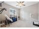 Spacious bedroom with ceiling fan and plenty of natural light at 3110 Lema Dr, Spring Hill, FL 34609