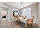 Dining area with a wood table and chairs and a view of a laundry room at 3110 Lema Dr, Spring Hill, FL 34609