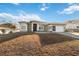 House exterior with driveway and landscaping at 3110 Lema Dr, Spring Hill, FL 34609
