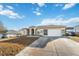 House exterior with a driveway, landscaping, and a motorhome parked nearby at 3110 Lema Dr, Spring Hill, FL 34609