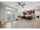 Open kitchen with dark cabinetry, stainless steel appliances, and an island with seating at 3110 Lema Dr, Spring Hill, FL 34609