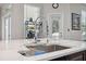 Modern kitchen island with sink and a built in cutting board at 3110 Lema Dr, Spring Hill, FL 34609