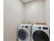 Laundry room with washer and dryer, and ample storage space at 3110 Lema Dr, Spring Hill, FL 34609