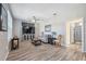 Spacious living room with hardwood floors and large TV at 3110 Lema Dr, Spring Hill, FL 34609