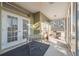 Relaxing screened porch with glass-top table and room for exercise equipment at 3110 Lema Dr, Spring Hill, FL 34609