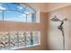 Shower with a large window and glass block feature at 3110 Lema Dr, Spring Hill, FL 34609