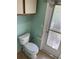 Bathroom with toilet and exterior access at 3151 Carlos Dr, Dunedin, FL 34698