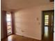 Bedroom with wood floors and view to backyard at 3151 Carlos Dr, Dunedin, FL 34698