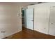 Bright bedroom with wood floors and access to bathroom at 3151 Carlos Dr, Dunedin, FL 34698