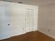 Bedroom with hardwood floors and closet at 3151 Carlos Dr, Dunedin, FL 34698