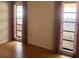 Bedroom with hardwood floors and two windows at 3151 Carlos Dr, Dunedin, FL 34698