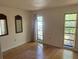 Bedroom with hardwood floors and large windows at 3151 Carlos Dr, Dunedin, FL 34698