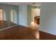 Spacious bedroom with mirrored walls and wood floors at 3151 Carlos Dr, Dunedin, FL 34698