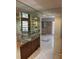Entryway with mirrored walls and wet bar at 3151 Carlos Dr, Dunedin, FL 34698