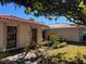 Side view showcasing the home's architecture and landscaping at 3151 Carlos Dr, Dunedin, FL 34698