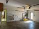 Garage with utility sink and water heater at 3151 Carlos Dr, Dunedin, FL 34698