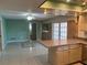 Kitchen with breakfast bar, access to the backyard and pool at 3151 Carlos Dr, Dunedin, FL 34698