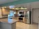 Spacious kitchen with stainless steel appliances and pool view at 3151 Carlos Dr, Dunedin, FL 34698