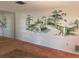 Living room with large mirror and scenic wall mural at 3151 Carlos Dr, Dunedin, FL 34698